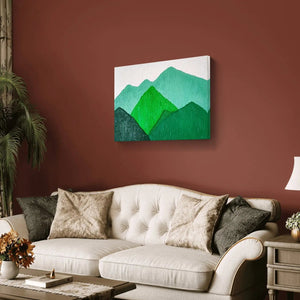 Handmade textured mountain landscape painting in green tones on a living room wall.