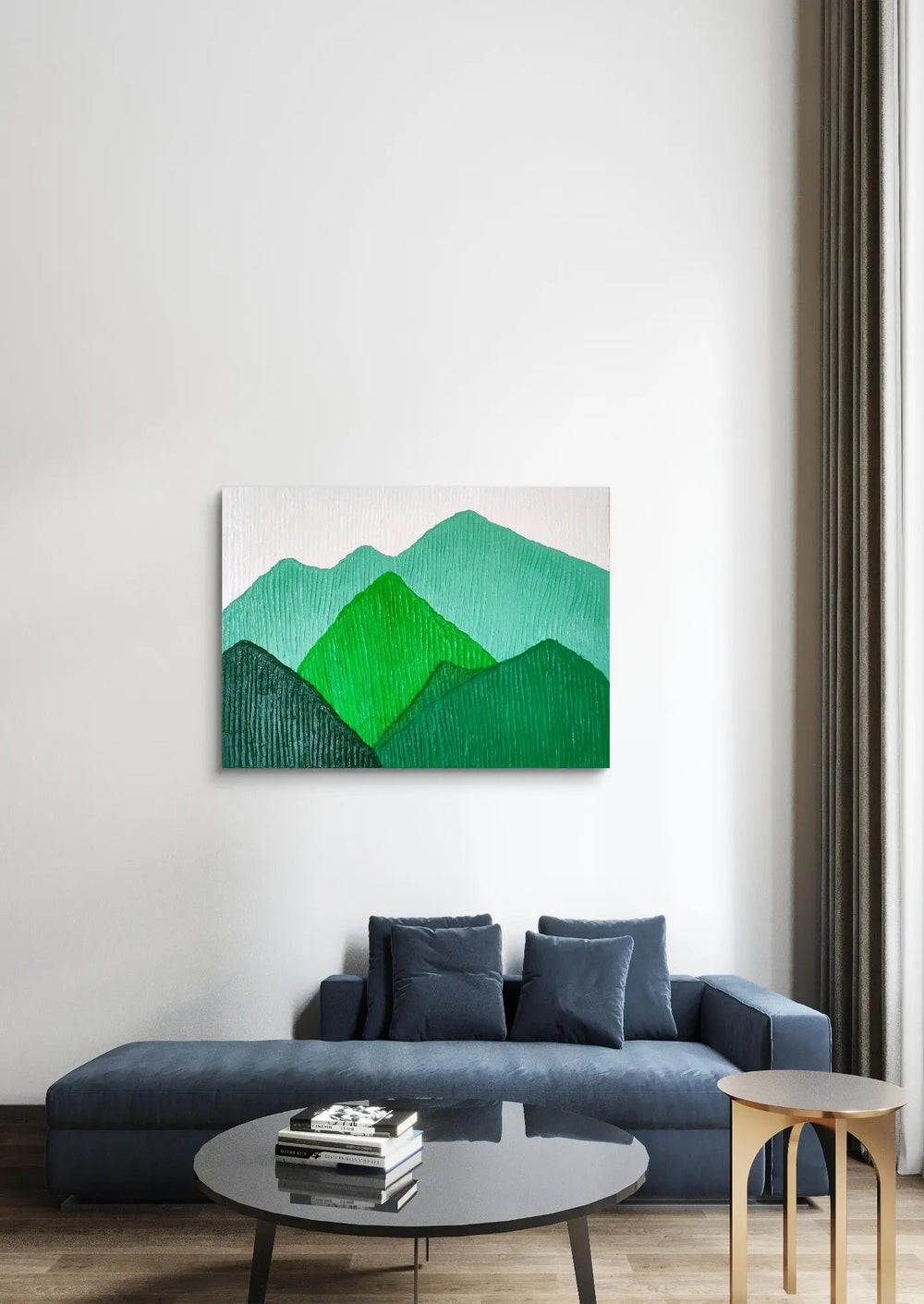 Modern green mountain landscape painting above a dark blue sofa in a contemporary living room.