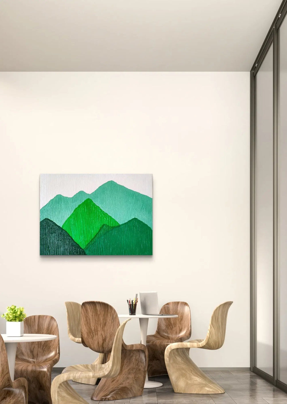 Textured mountain landscape artwork in green hues displayed in a modern dining area.