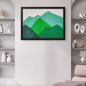 Framed green mountain landscape painting displayed in a modern, neutral-toned room.