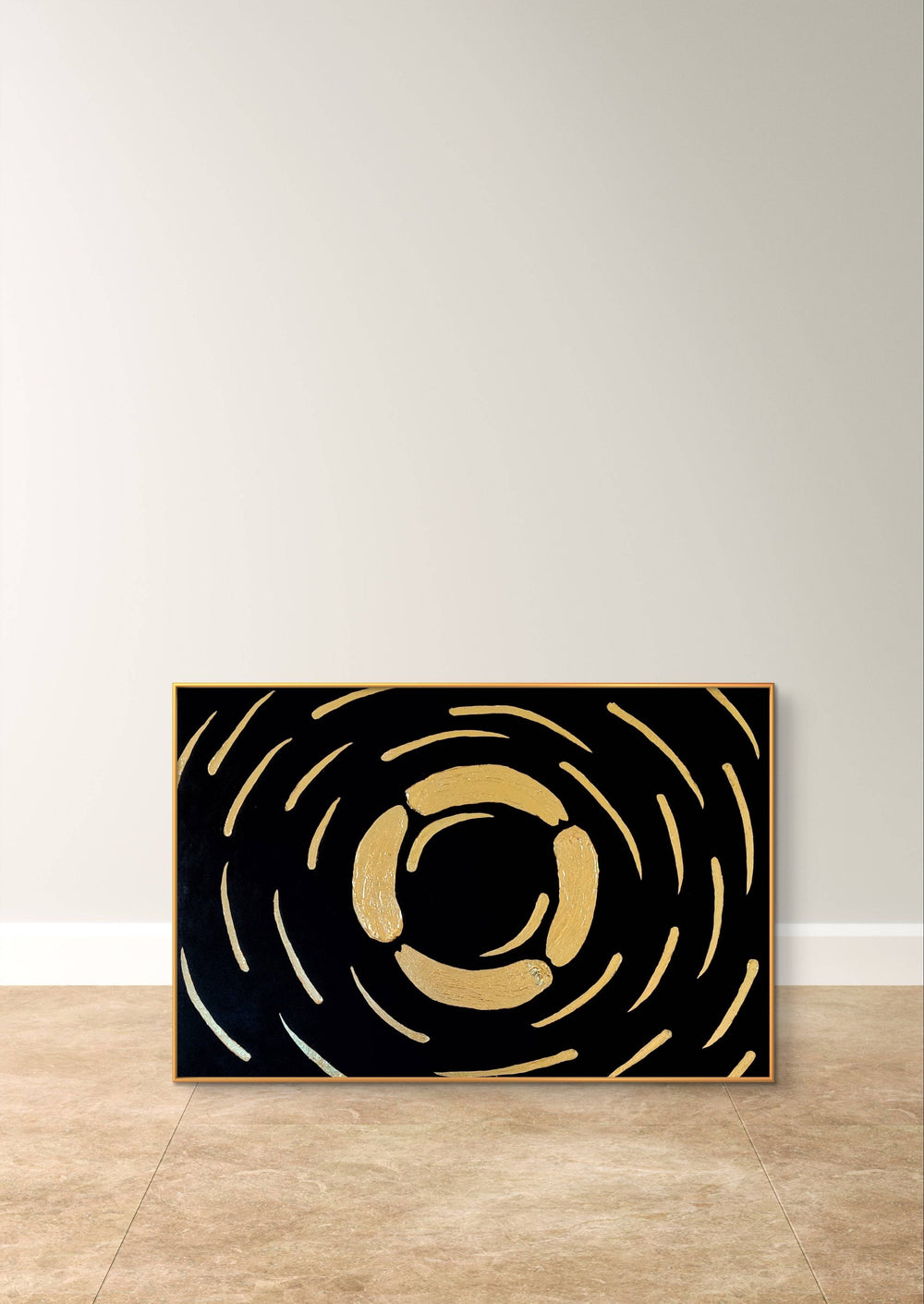 Abstract textured painting with gold and black design, leaning against a neutral wall on a tiled floor.