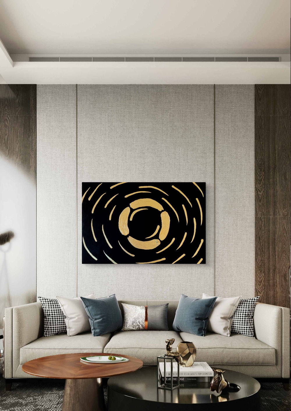 Abstract textured painting with gold accents on black background, showcased in a modern living room with neutral tones.