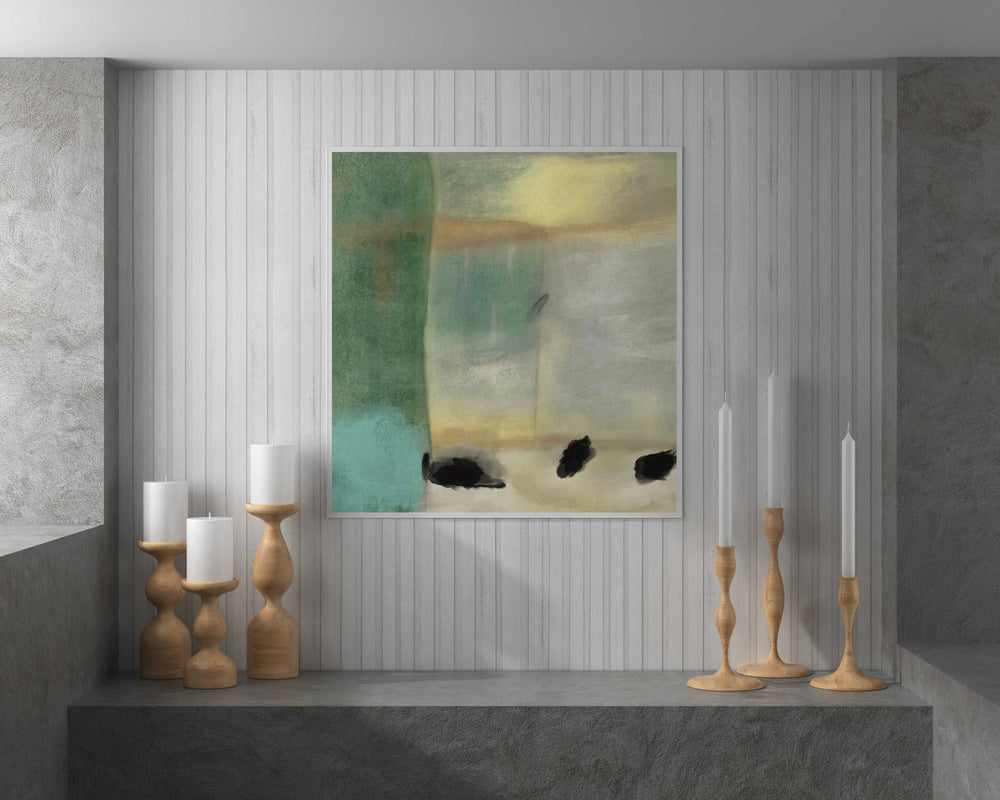 a painting hanging on a wall next to candles