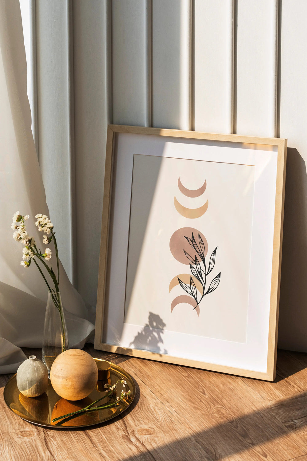 a picture frame sitting on top of a wooden table